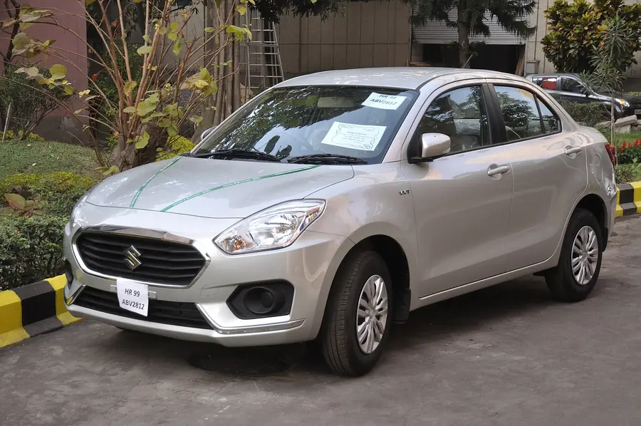 Silver Maruti Suzuki Dzire sedan, the standard 4-seat cab in Chennai